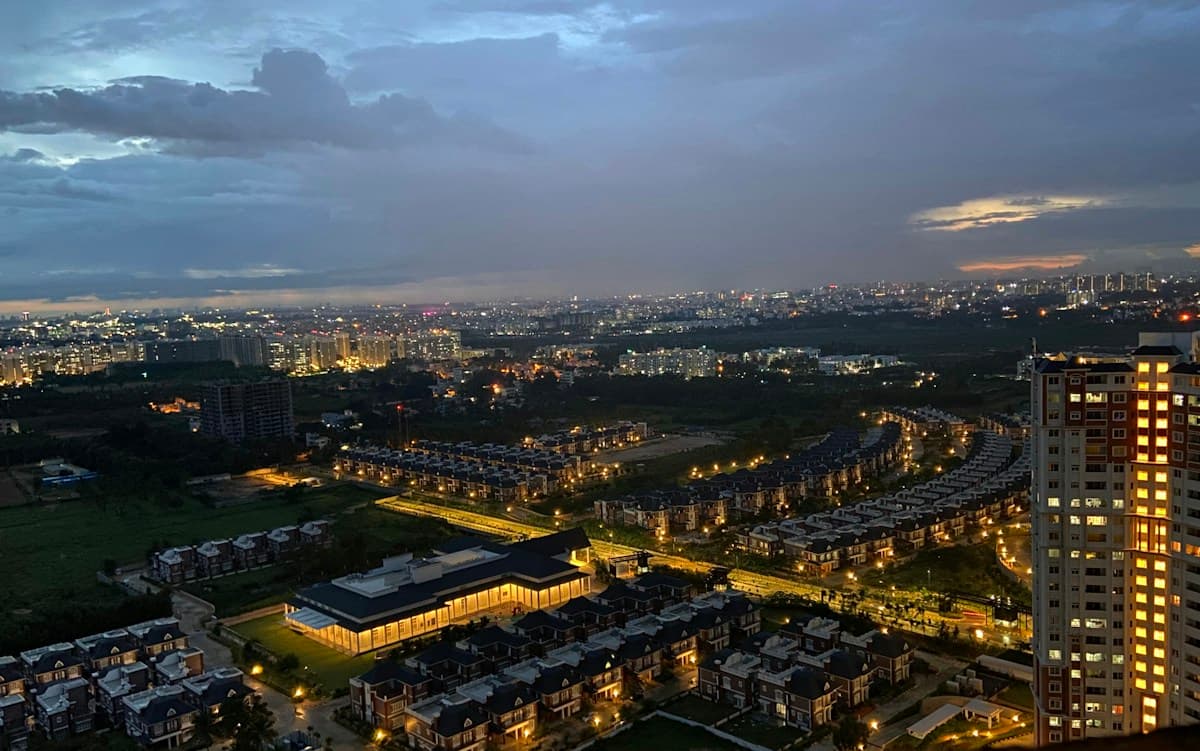 Bengaluru skyline at dusk with city lights stretching to the horizon